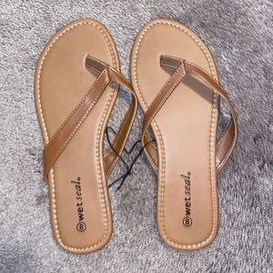 WET SEAL FLIP FLOPS NEVER WORN.